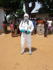 While on assignment in Liberia, John Moore wore protective gear to protect himself from getting the Ebola virus.