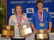 Lindale High school student Jessie Elliot and White Oak High School student Austin Jordan display their medals and plaques after the journalism awards ceremony at the Academic State Meet. Both students were in all four journalism contests, and both students medaled in each of the four contests.