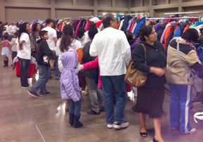 Parents and their children browse the coat selection at the annual Coats for Kids drive. 