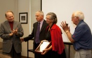 Former Executive Director William Farney, current Executive Director Charles Breithaupt and former Executive Director Bailey Marshall congratulate former Policy Director Bonnie Northcutt for her dedication and commitment to UIL for the past four decades.