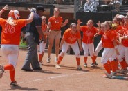 The Celina Bobcats celebrate as shortstop Shelby Carter runs home after hitting a game-winning homerun at the bottom of the 11th inning. The Bobcats beat the Huntington Devilettes 4-3 in the semifinal game at the UIL State Softball Tournament. Carter's homerun was the first of the 2011 State Tournament.