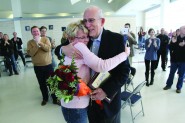 After she is presented the Yearbook Teacher of the Year Award, Cindy Todd embraces H.L. Hall at Westlake High School. 