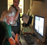 At the 2010 ILPC Summer Workshop, instructor Andrea Lorenz works with adviser Bill DeFries from Corpus Christi King High School. DeFries and his editor took the New Media class to learn how to create videos, audio slideshows, websites and more. Photo was taken by a 2010 ILPC Summer Workshop photography student.