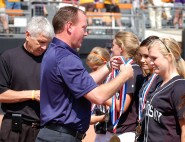 Dr. Jamey Harrison drapes medals on the Lindsay Varsity Softball team at the UIL State Tournament. Lindsay was a semifinalist in 2011. Photo by Jeanne Acton