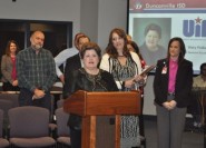 Journalism teacher Mary Pulliam accepts her Sponsor Excellence Award at the February Duncanville ISD School Board meeting. Pulliam has taught journalism for more than 30 years at Duncanville High School.