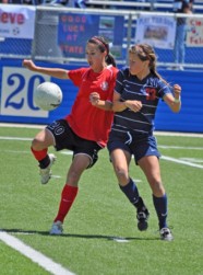 At the Soccer State Championship tournament, senior midfielder Camice Karing, a Colleyville Heritage Panther, moves to control the ball as senior defender Erin McLemore, a Clear Lake Falcon, approaches. The Panthers won the semifinal game 1-0. The Panthers lost the championship game to the Boyd Broncos 0-1 in overtime.