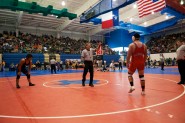 Robert Rios of Lubbock Monterey High School and John Rodriquez of San Antonio Roosevelt High School meet during their Round 1 Match at the UIL State Wrestling Tournament in Austin.