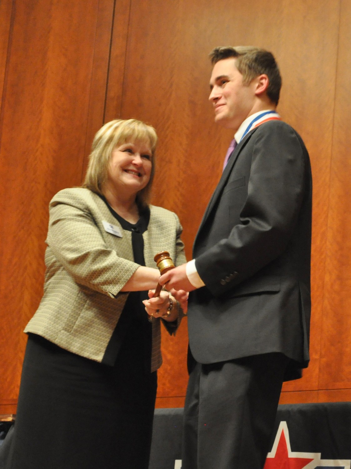 Speech and Debate Director Jana Riggins congratulates Zach McMeans from Borden County ISD for also winning the the Outstanding Presiding Officer.