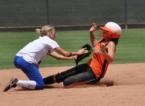 A Brock varsity softball player makes a critical tag on an Elysian Field player during the fifth inning in the 2A Girls' State Softball semifinal game. At the bottom of the seventh inning, Brock scored to win the game 1-0. Brock beat Hallettsville Saturday, June 6 at 11 a.m. for the 2A championship. For more photos, see the Athletics page. 