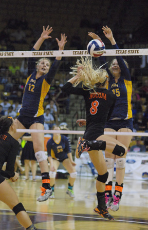 Seniors Jordan Kotara and Corin Nelson from Poth High School go up for a block against the Nocona Lady Indians. Poth won the 2A State Volleyball Championship game in three games against Nocona.